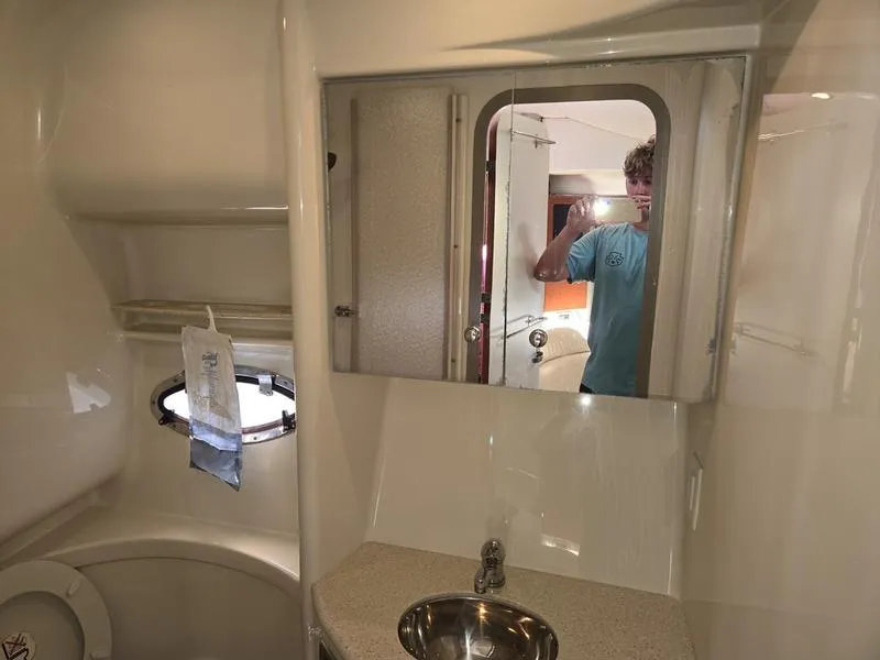 Slide: The Image of 2008 Formula 37 PC yacht bathroom with sink, mirror, and porthole window. - 32