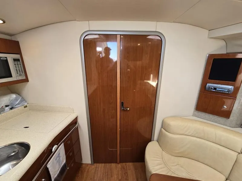 Slide: The Image of Interior of 2008 Formula 37 PC yacht with kitchenette and seating area. - 33