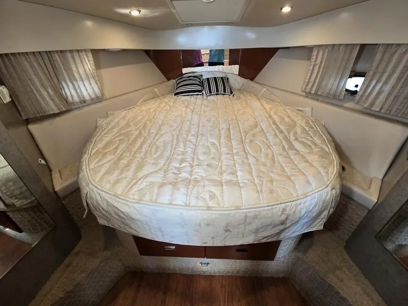 Slide: The Image of Luxurious 2008 Formula 37 PC yacht cabin with a cozy round bed and elegant decor. - 34