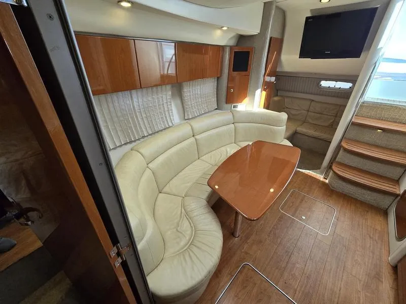 Slide: The Image of Luxurious interior of a 2008 Formula 37 PC yacht with plush seating and wooden accents. - 37