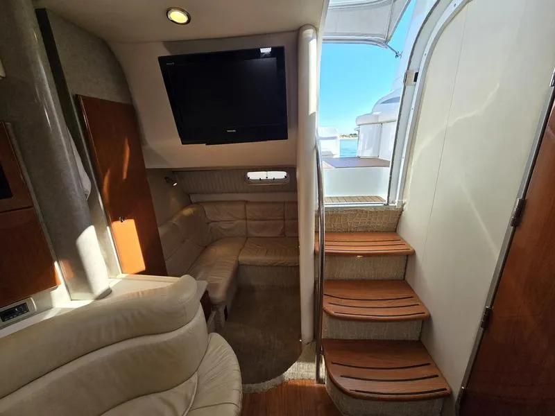 Slide: The Image of Interior of 2008 Formula 37 PC yacht with cozy seating and wooden steps. - 39