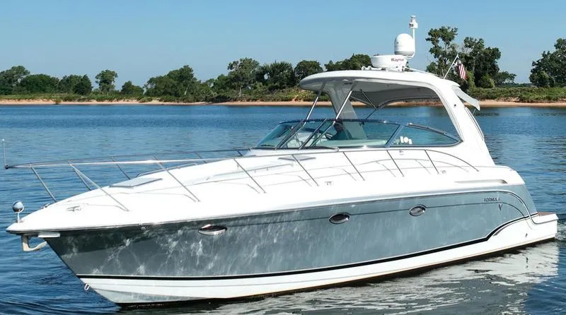 Slide: The Image of 2008 Formula 37 PC yacht on calm water, clear sky, and distant trees. - 7