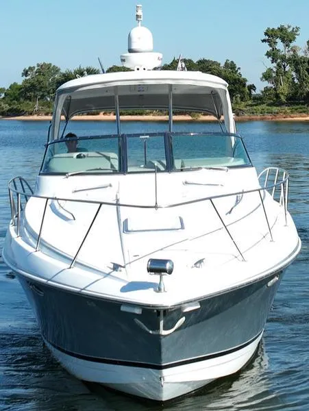 Slide: The Image of 2008 Formula 37 PC yacht cruising on a calm lake with trees in the background. - 8