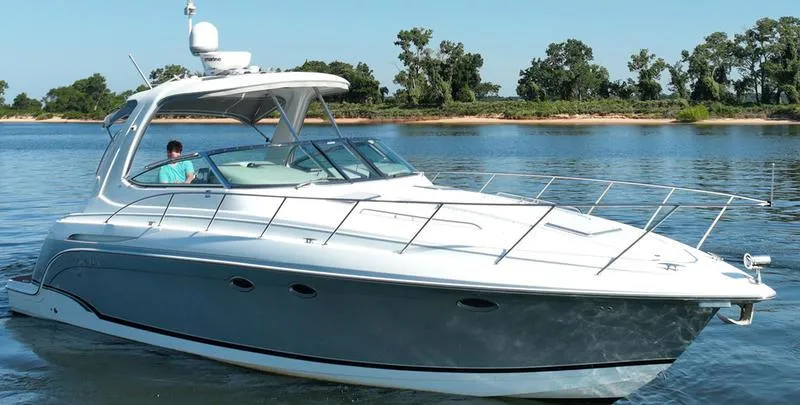 Slide: The Image of 2008 Formula 37 PC yacht cruising on a calm lake with trees in the background. - 9