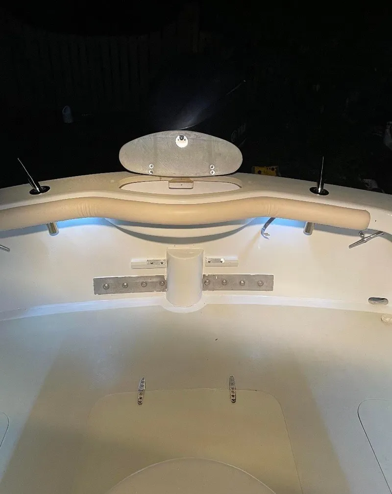 Slide: The Image of 2011 Custom Carolina Express boat interior with illuminated seating and rod holders. - 10