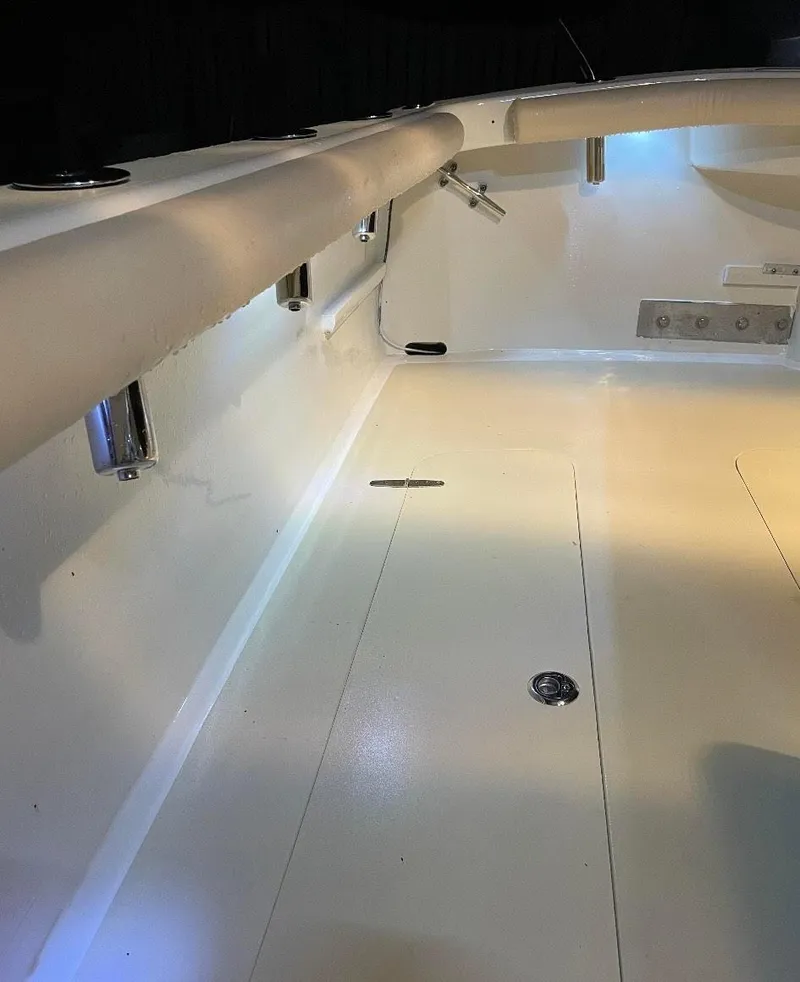 Slide: The Image of 2011 Custom Carolina Express boat interior with sleek white finish and modern fixtures. - 9