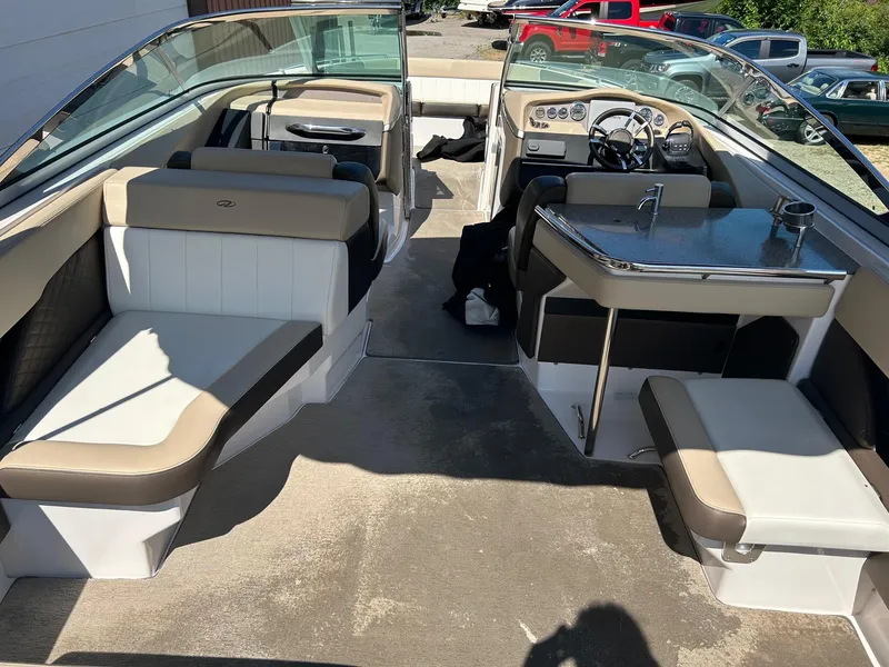 Slide: The Image of 2013 Regal 3200 Bowrider interior with seating and helm, showcasing luxury and comfort. - 10