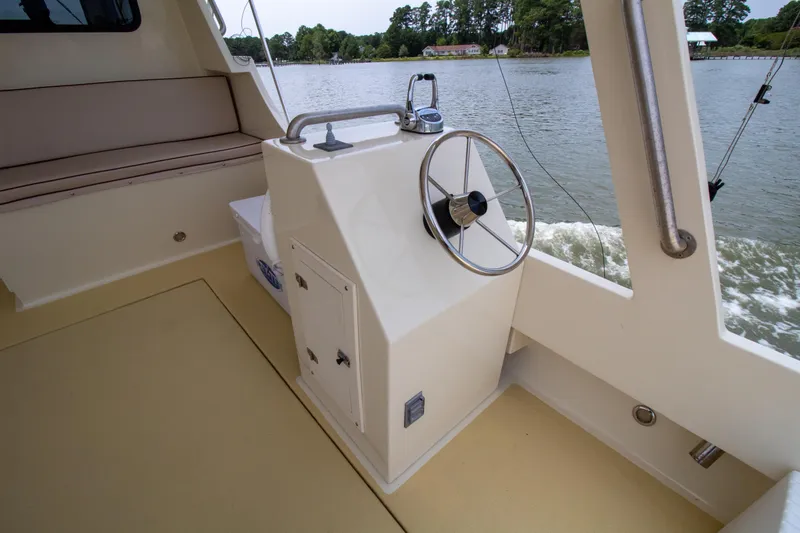 Slide: The Image of Interior of 2008 Chesapeake 48 Deadrise boat with steering wheel and seating. - 20