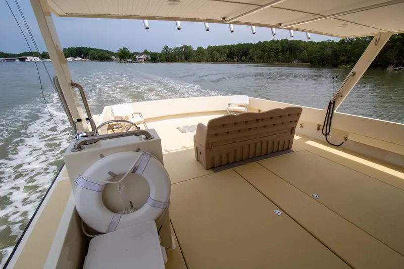 Slide: The Image of Chesapeake 48 Deadrise boat, 2008 model, cruising on a calm river with scenic views. - 28