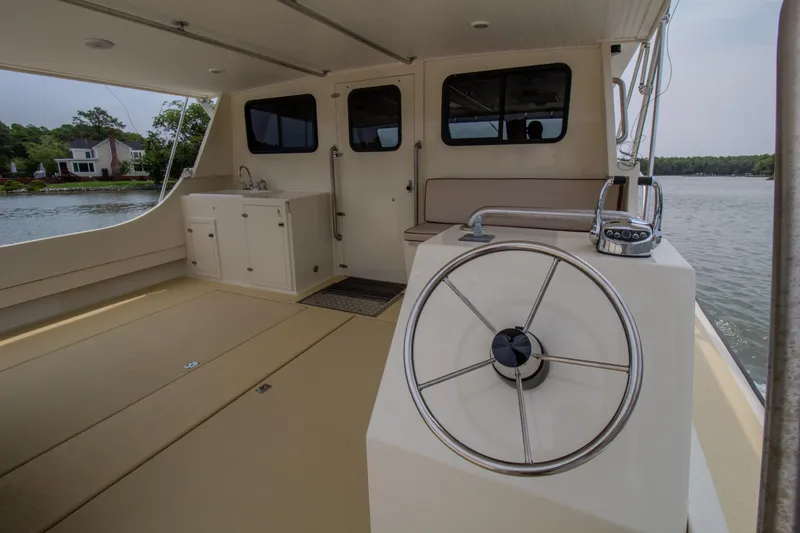 Slide: The Image of Interior of 2008 Chesapeake 48 Deadrise boat with steering wheel and cabin view. - 3
