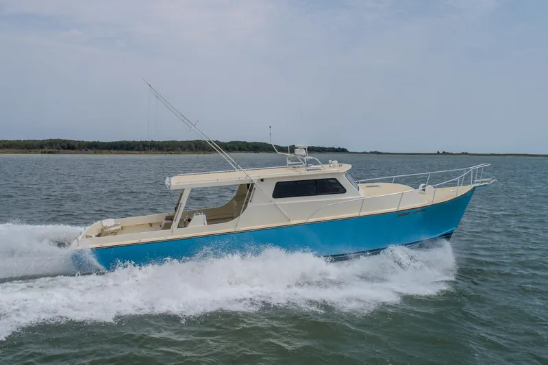 Slide: The Image of 2008 Chesapeake 48 Deadrise boat cruising on open water. - 35