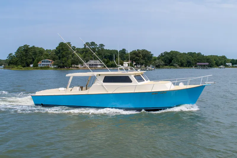 Slide: The Image of Blue 2008 Chesapeake 48 Deadrise boat cruising on a scenic river. - 38
