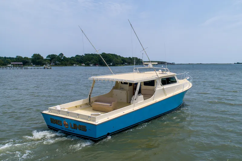 Slide: The Image of Chesapeake 48 Deadrise boat, 2008 model, cruising on a calm river. - 39