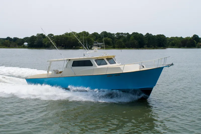 Slide: The Image of 2008 Chesapeake 48 Deadrise boat cruising on a calm lake. - 40