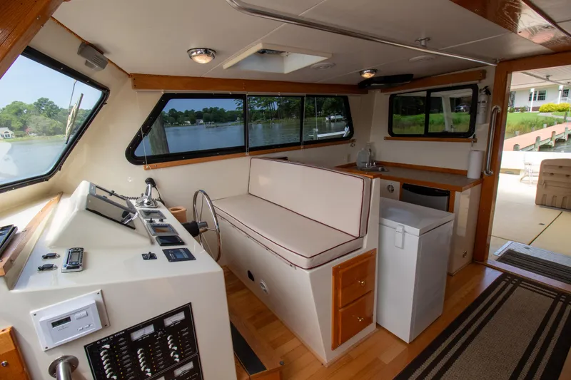 Slide: The Image of Interior of 2008 Chesapeake 48 Deadrise boat with helm, seating, and kitchenette. - 7