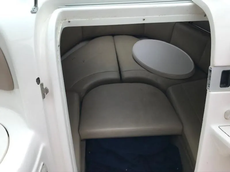 Slide: The Image of 2001 Chaparral 235 SSi boat cabin interior with seating and table. - 10