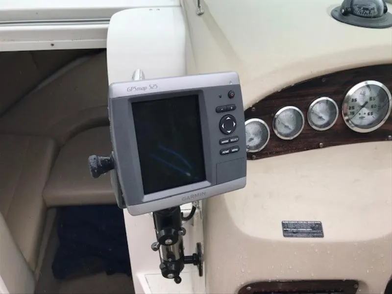 Slide: The Image of 2001 Chaparral 235 SSi boat dashboard with Garmin GPS device and gauges. - 11