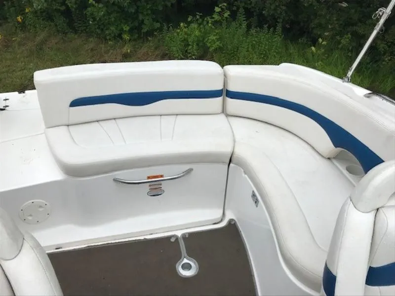 Slide: The Image of 2001 Chaparral 235 SSi boat interior with white and blue seating. - 13