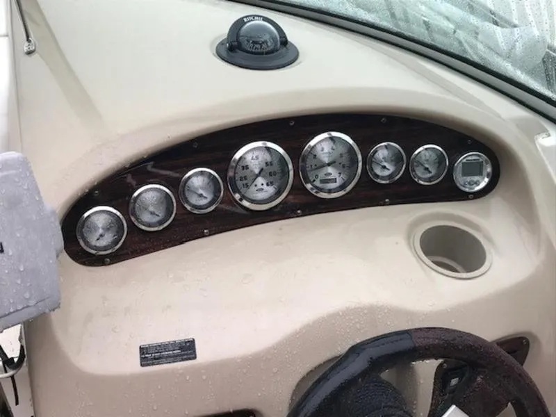 Slide: The Image of Dashboard of 2001 Chaparral 235 SSi boat with gauges and steering wheel. - 5