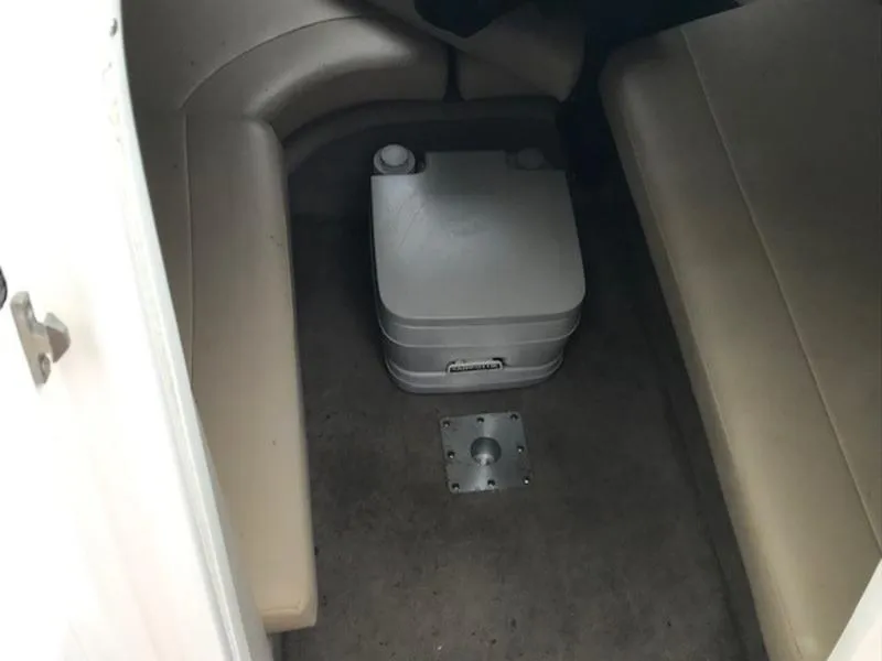 Slide: The Image of 2001 Chaparral 235 SSi cabin interior with portable toilet and seating. - 8