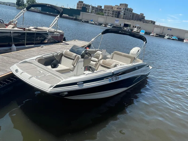 Slide: The Image of 2020 Crownline E 205 XS boat docked on a sunny day. - 3