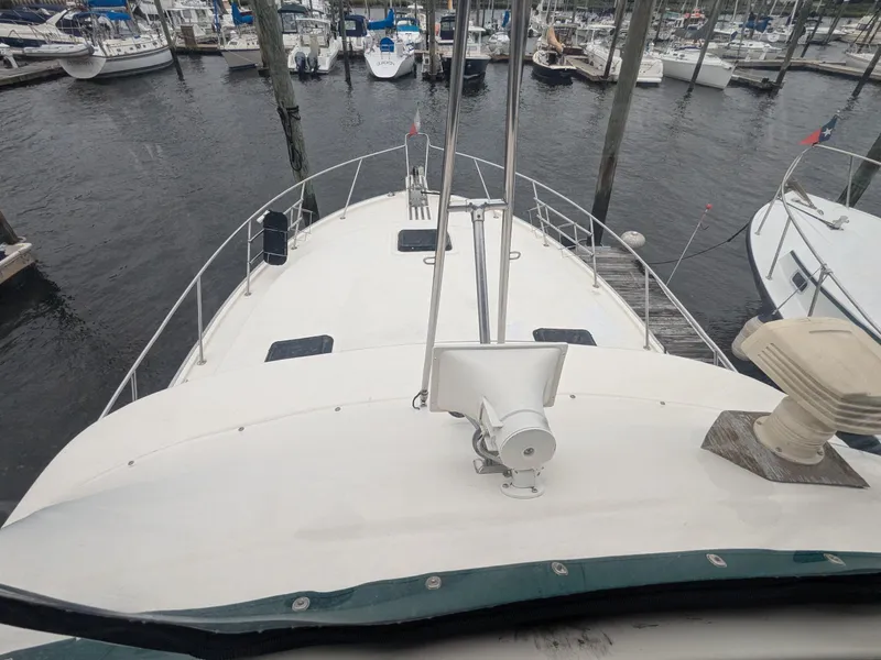 Slide: The Image of 1981 Silverton 37 Convertible yacht docked at marina, view from upper deck. - 14