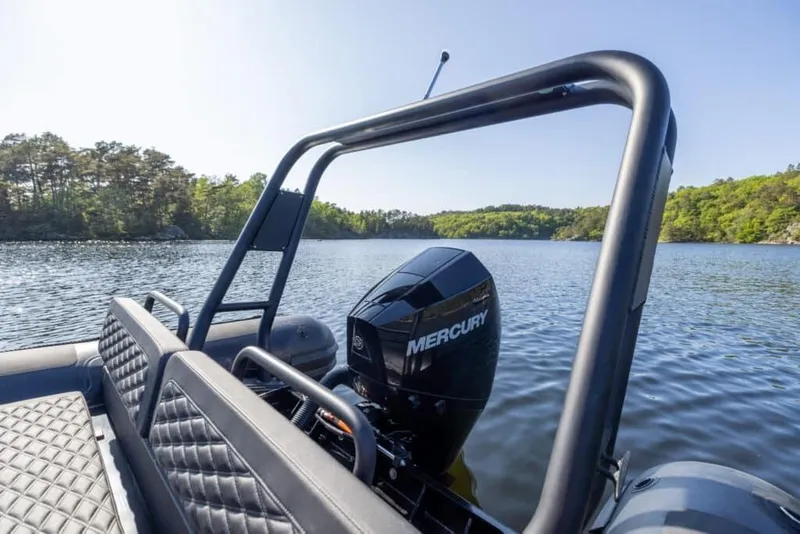 Slide: The Image of Highfield Patrol 860 boat on calm lake, 2026 model. - 4