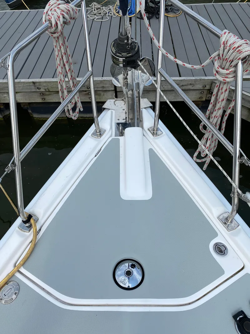 Slide: The Image of Bow of a 2008 Hunter 33 sailboat with deck fittings and ropes. - 14