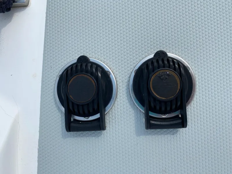 Slide: The Image of Two black deck fittings on a 2008 Hunter 33 boat. - 16