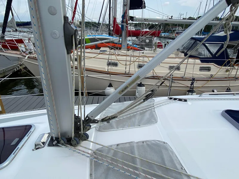 Slide: The Image of Hunter 33 sailboat deck with rigging and marina background, 2008 model. - 25