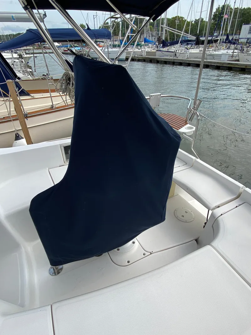 Slide: The Image of Covered helm station on a 2008 Hunter 33 sailboat at a marina. - 35