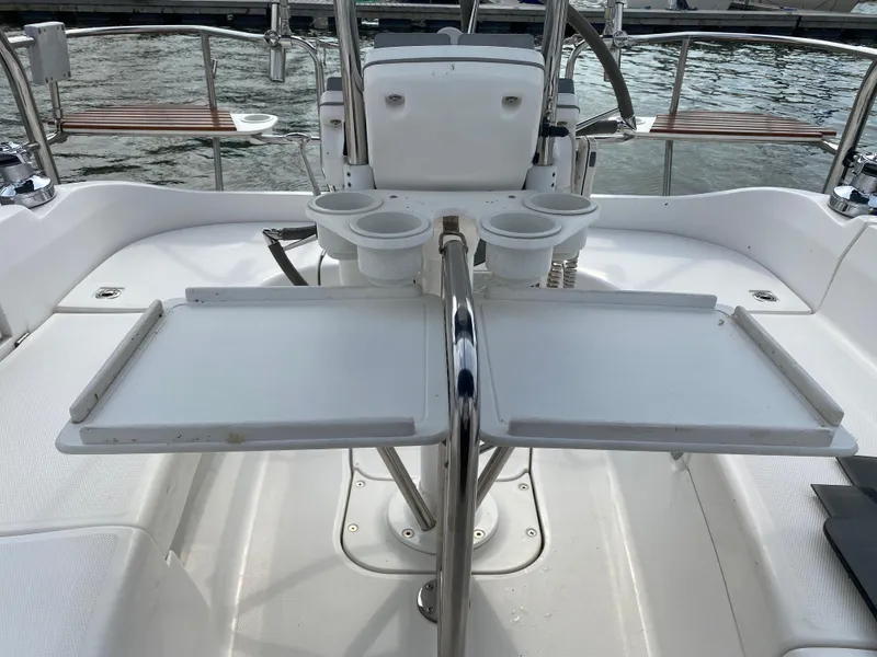 Slide: The Image of Cockpit of 2008 Hunter 33 sailboat with foldable table and cup holders. - 39