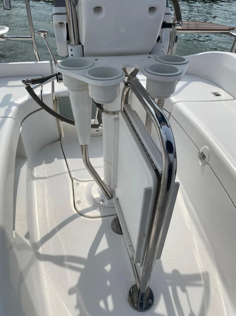 Slide: The Image of Cockpit area of a 2008 Hunter 33 sailboat with cup holders and railing. - 40