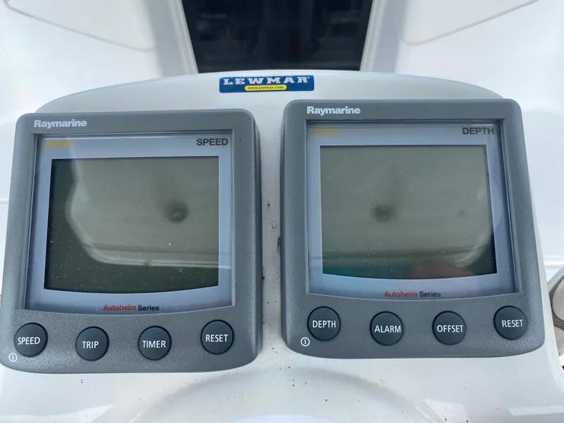 Slide: The Image of Raymarine speed and depth displays on a 2008 Hunter 33 sailboat dashboard. - 43
