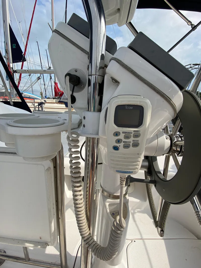 Slide: The Image of 2008 Hunter 33 sailboat cockpit with Icom marine radio and steering wheel. - 46