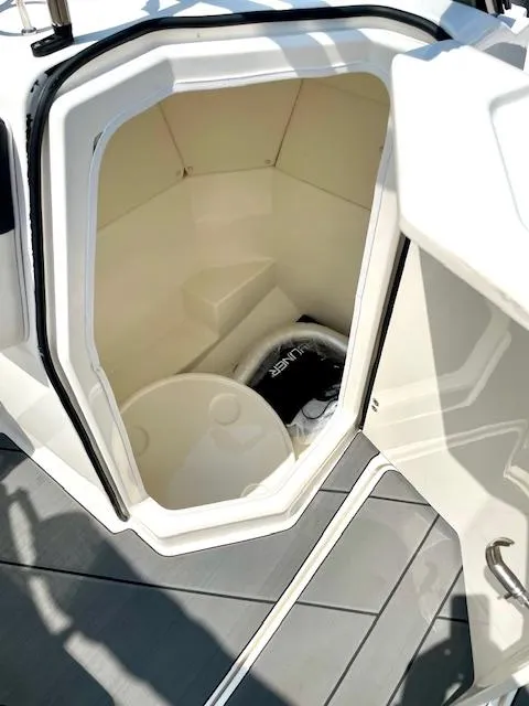 Slide: The Image of 2021 Bayliner DX 2250 boat storage compartment with interior view. - 11