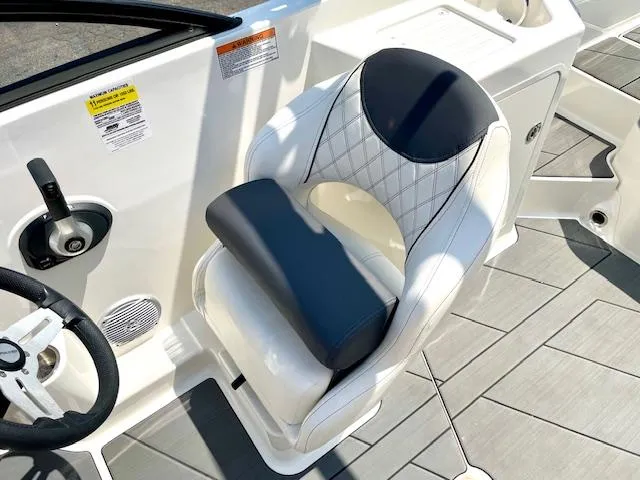 Slide: The Image of 2021 Bayliner DX 2250 boat seat with quilted design and modern controls. - 13