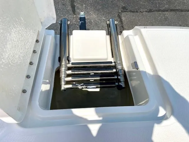 Slide: The Image of Bayliner DX 2250 2021 boat ladder compartment with stainless steel retractable ladder. - 17