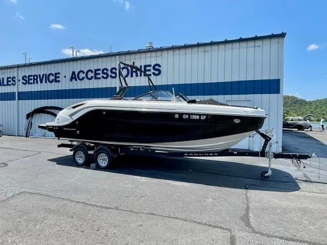 Slide: The Image of 2021 Bayliner DX 2250 boat on trailer outside sales and service building. - 3