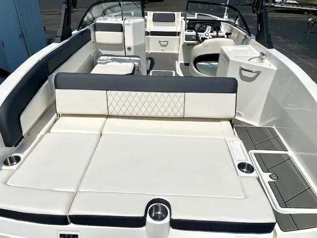 Slide: The Image of 2021 Bayliner DX 2250 boat interior with spacious seating and modern design. - 7