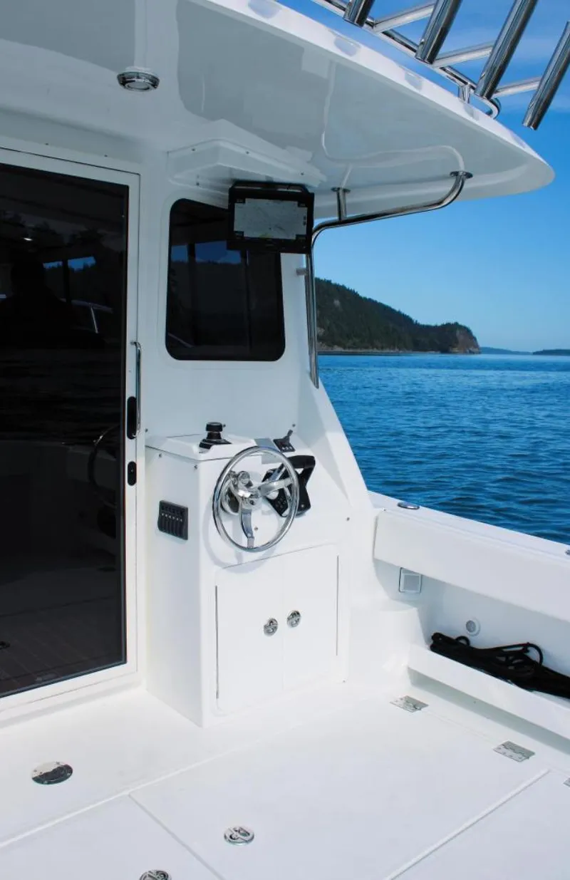 Slide: The Image of 2022 Ocean Sport 30 Roamer #124 boat interior with ocean view. - 15