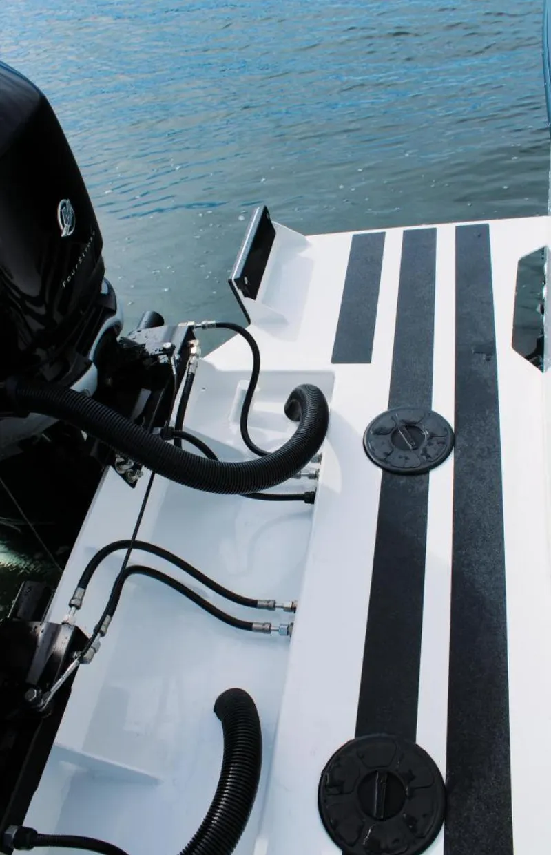 Slide: The Image of 2022 Ocean Sport 30 Roamer #124 boat deck with engine and water view. - 16