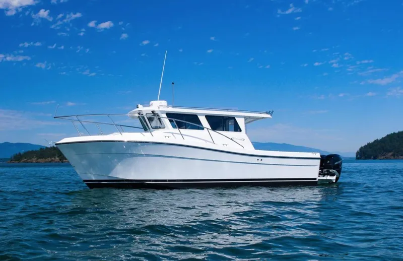 Slide: The Image of 2022 Ocean Sport 30 Roamer #124 boat on calm blue water. - 22