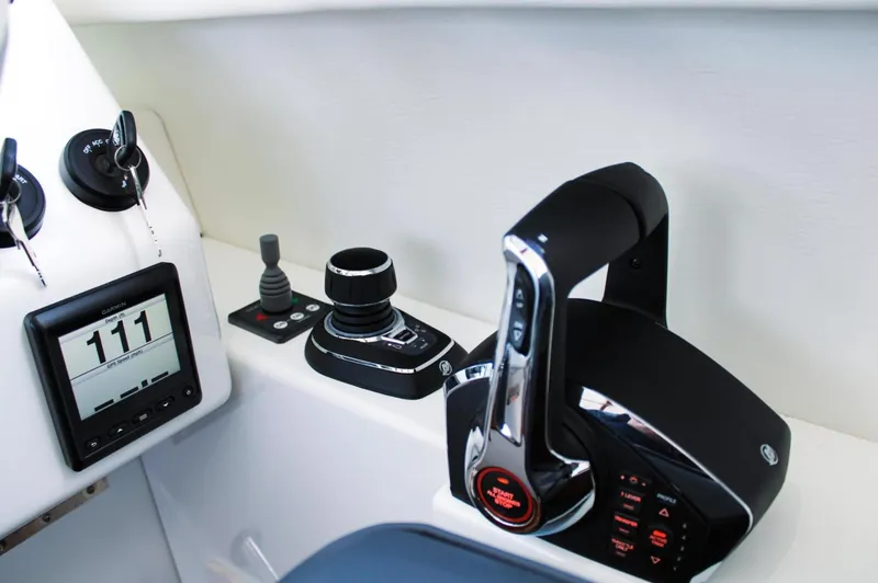 Slide: The Image of Control panel of 2022 Ocean Sport 30 Roamer #124 boat, featuring modern navigation equipment. - 9