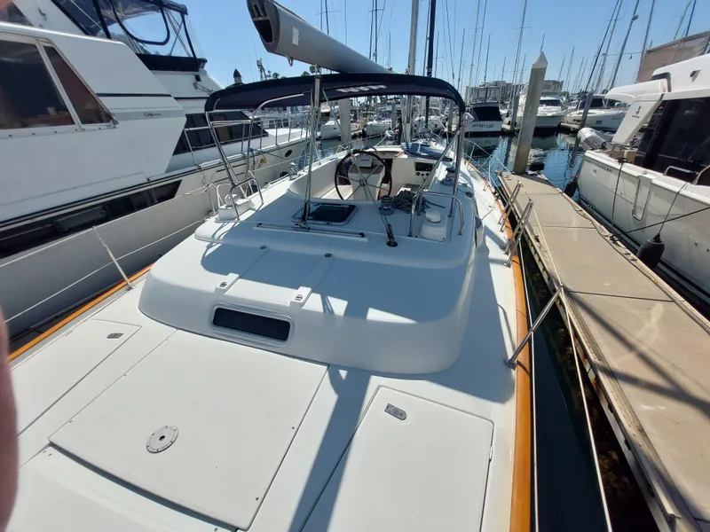 Slide: The Image of 2002 Beneteau Oceanis 42CC sailboat docked in marina, sunny day. - 14