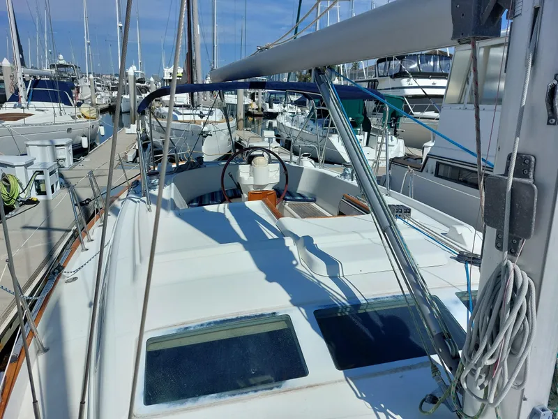 Slide: The Image of Beneteau Oceanis 42CC sailboat, 2002 model, docked in a marina. - 21