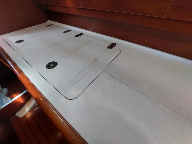 Slide: The Image of Interior view of 2002 Beneteau Oceanis 42CC sailboat with wooden and white surfaces. - 46