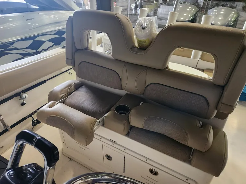 Slide: The Image of 2016 Key West 281 Billistic boat interior with comfortable seating and cup holder. - 13
