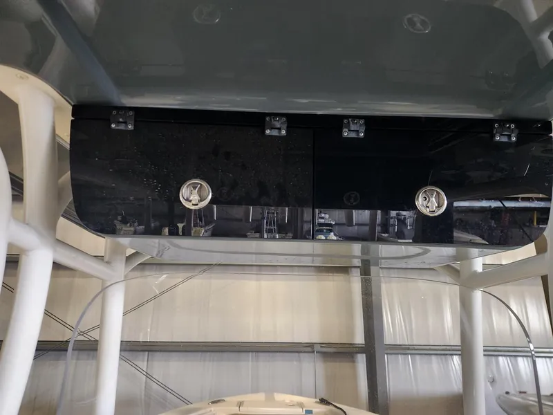 Slide: The Image of 2016 Key West 281 Billistic boat console with storage compartments in a garage. - 15