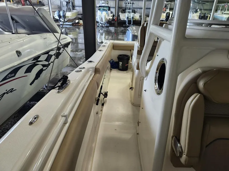 Slide: The Image of 2016 Key West 281 Billistic boat interior with seating and storage in a showroom. - 20